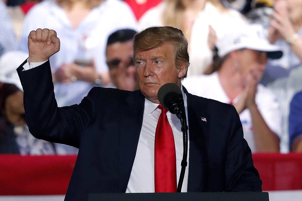 President Trump acknowledges the crowd at the end of his rally in Panama City Beach, Fla., Wedn ...