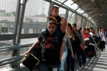Cuban migrants are escorted by Mexican immigration officials in Ciudad Juarez, Mexico, as they ...