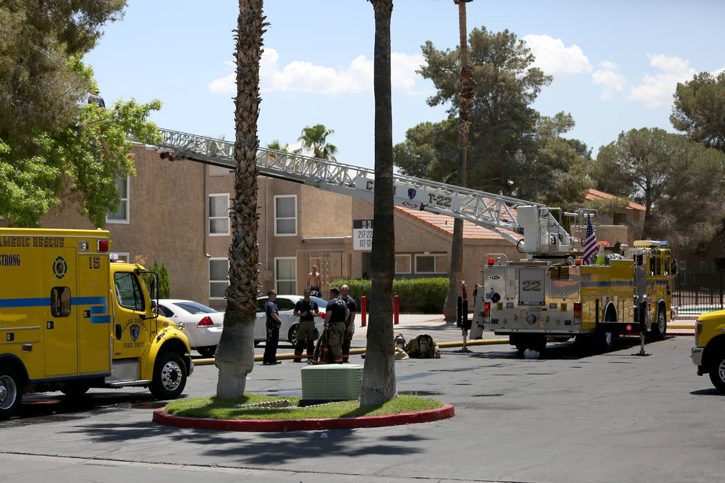 Firefighters respond to a two-alarm fire Monday morning, May 13, 2019 at an apartment building ...