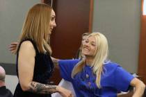 Suspended attorney Alexis Plunkett, left, is congratulated by a supporter, who declined to give ...