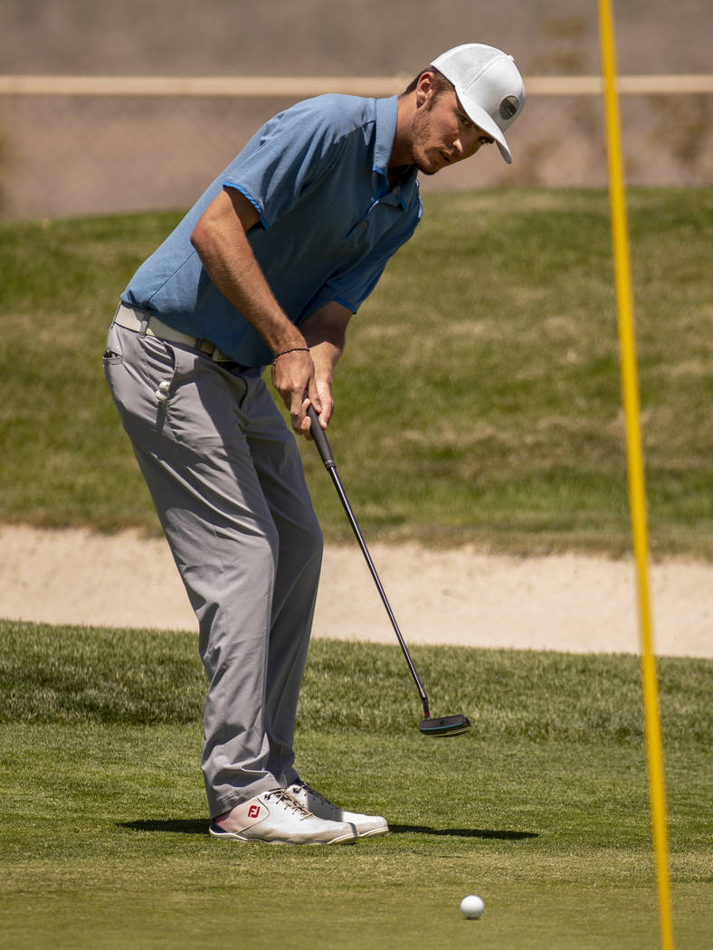 Golfer Van Thomas eyes a ball on the way to the hole during a PGA US Open qualifying round at t ...