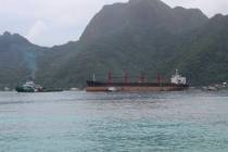 The North Korean cargo ship, Wise Honest, middle, was towed into the Port of Pago Pago in the l ...