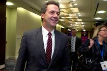Montana Gov. Steve Bullock walks to a Feb. 23, 2019, meeting during the National Governors Asso ...