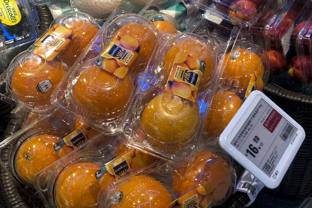 Oranges from the United States are on sale at a supermarket in Beijing, Tuesday, May 14, 2019. ...