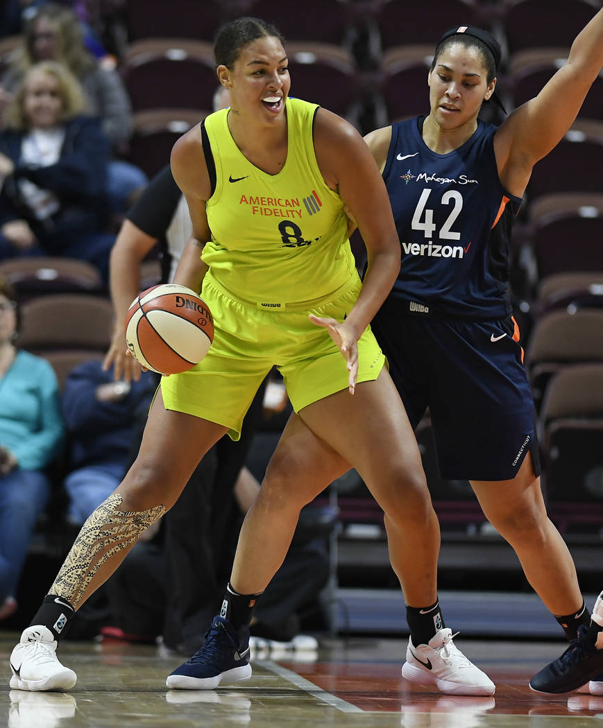 Dallas Wings' Liz Cambage, left, and Connecticut Sun's Brionna Jones during a preseason WNBA ba ...