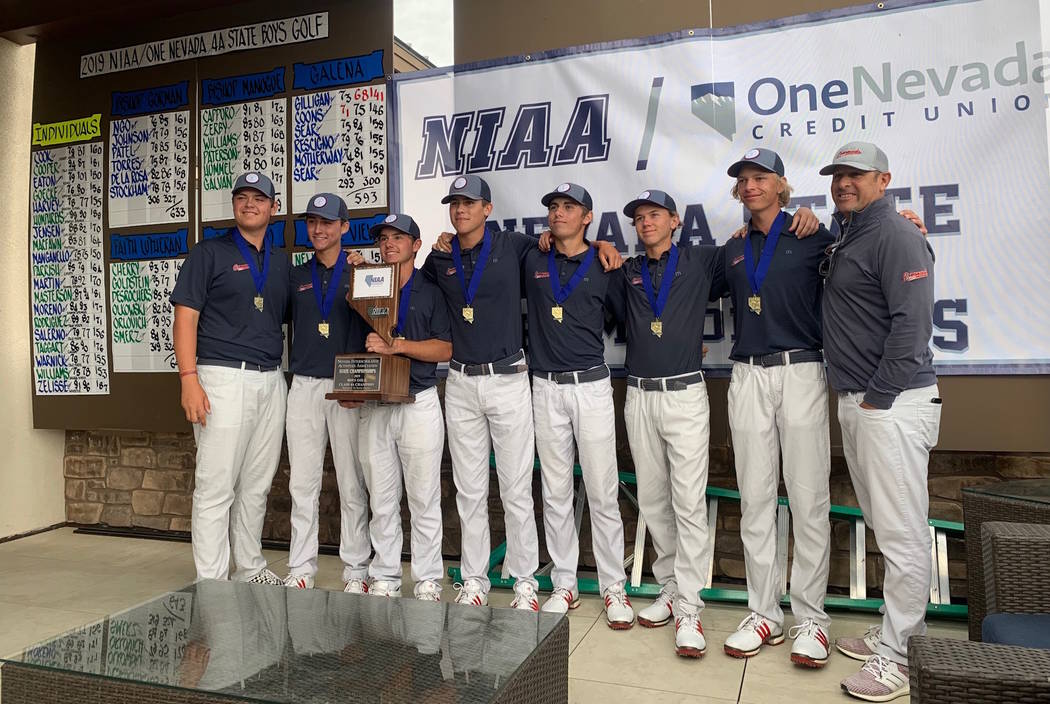 Coronado's boys golf team poses with the trophy after winning the Class 4A state championship a ...