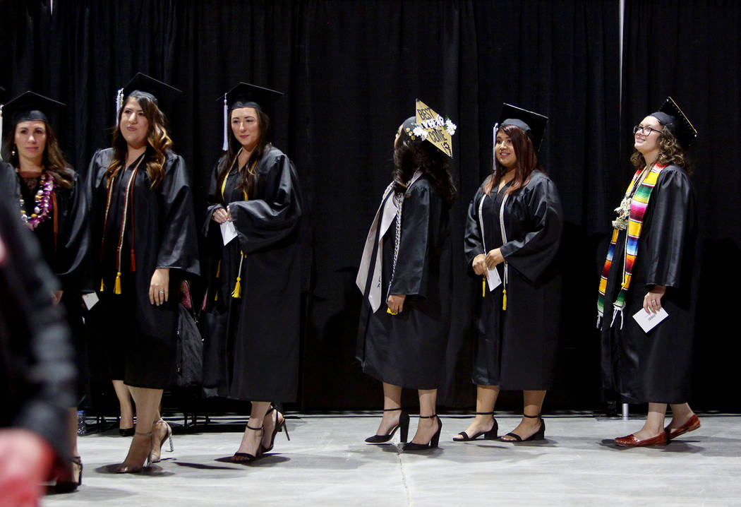 Students of the first graduating class for the new Deaf Studies program prepare to receive thei ...