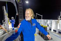In this photo provided by Atlantic Productions for Discovery Channel, Victor Vescovo emerges fr ...