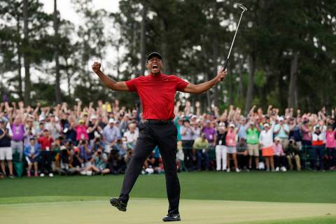In this Sunday, April 14, 2019, file photo, Tiger Woods reacts as he wins the Masters golf tour ...