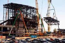 The newest truss is lifted and soon attached to the top of Raiders Stadium on Wednesday, May 1, ...