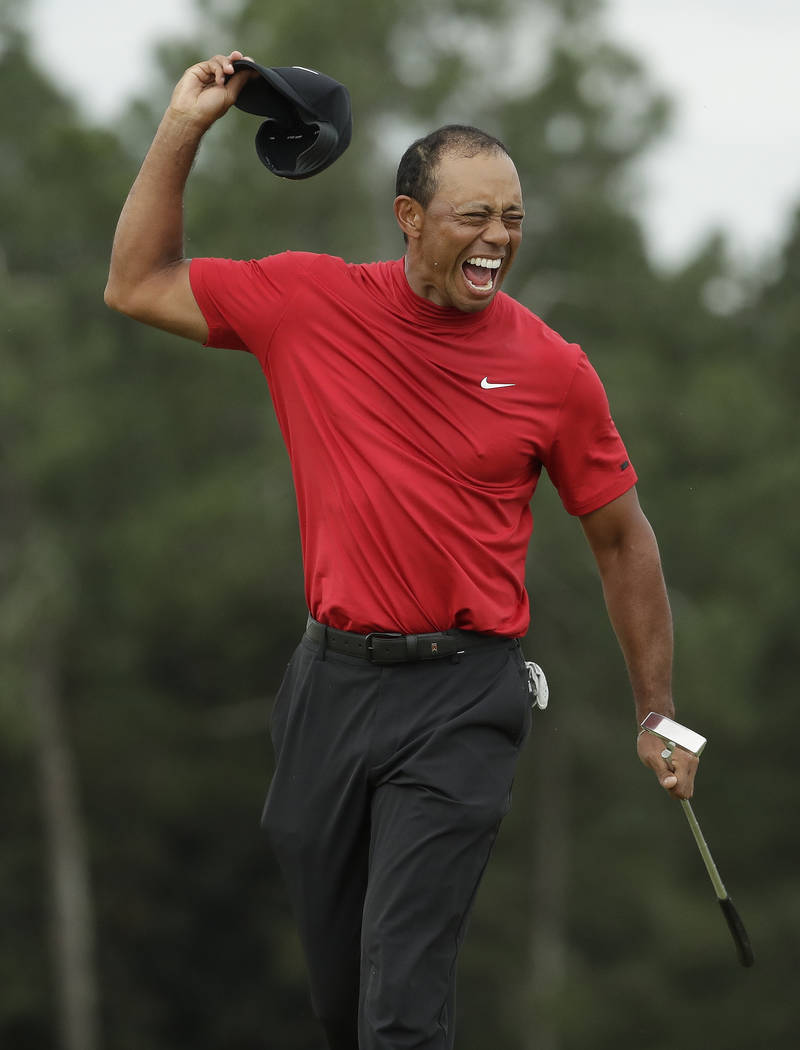 Tiger Woods reacts as he wins the Masters golf tournament Sunday, April 14, 2019, in Augusta, G ...