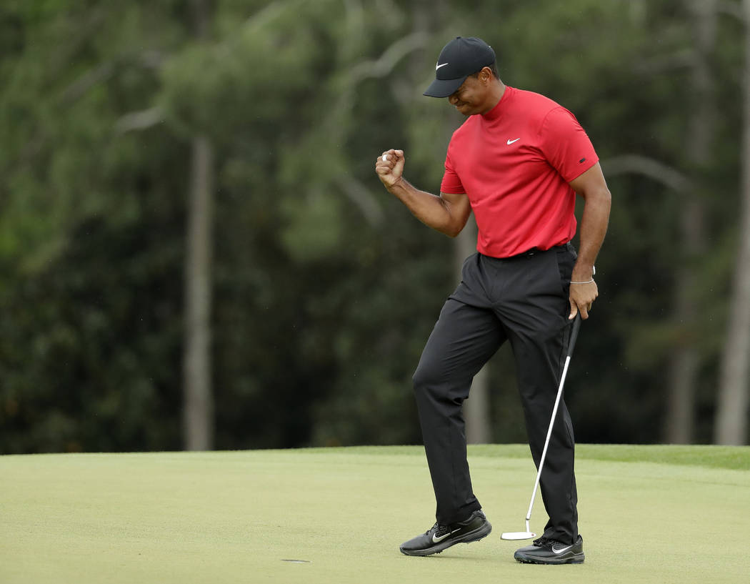 Tiger Woods reacts as he wins the Masters golf tournament Sunday, April 14, 2019, in Augusta, G ...