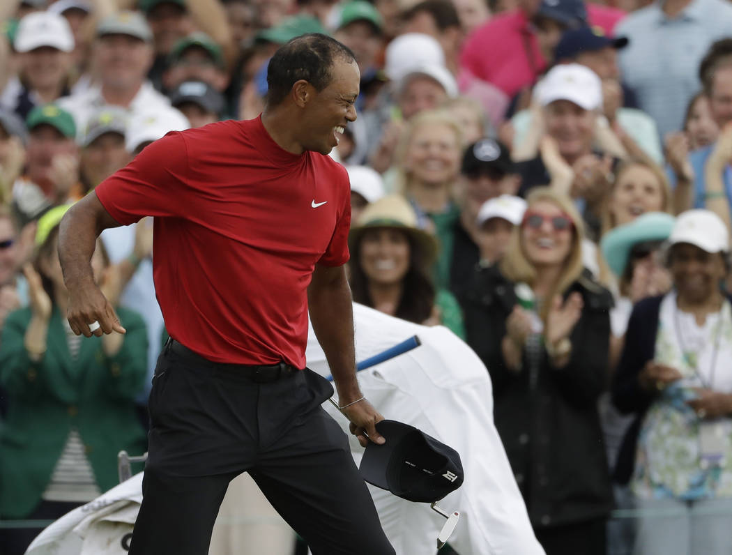 Tiger Woods reacts as he wins the Masters golf tournament Sunday, April 14, 2019, in Augusta, G ...