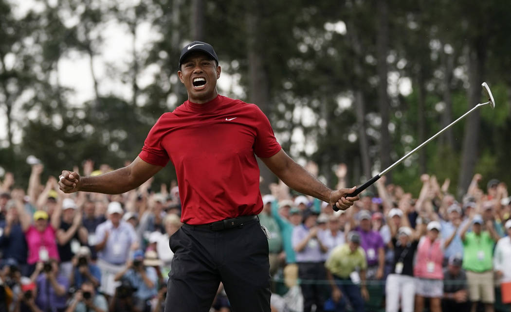 Tiger Woods reacts as he wins the Masters golf tournament Sunday, April 14, 2019, in Augusta, G ...