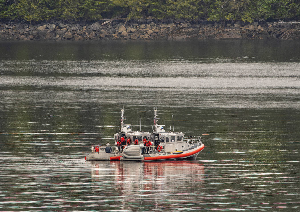 Two U.S. Coast Guard 45-foot response boats drift through George Inlet as part of a search effo ...