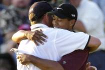 Tiger Woods hugs caddie, Steve Williams, after winning the PGA Championship on Sunday, Aug. 20, ...