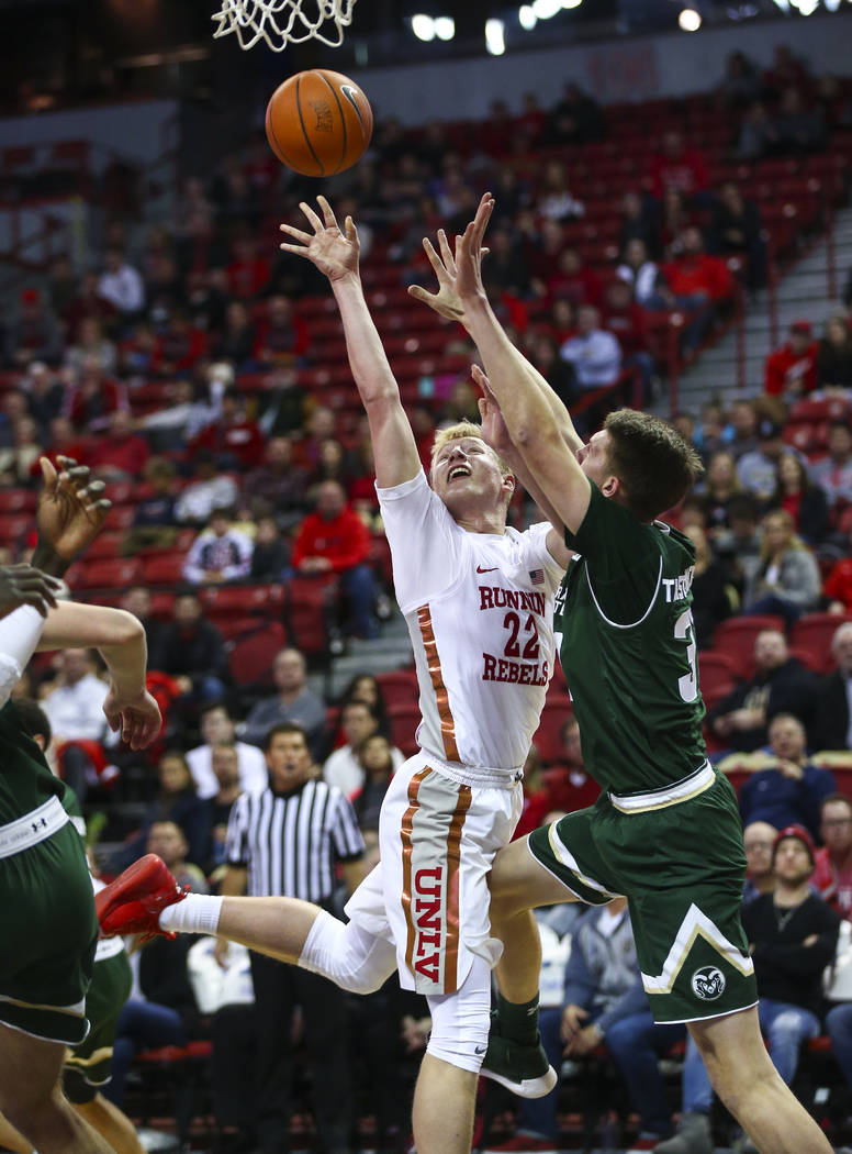 UNLV Rebels guard Trey Woodbury (22) shoots against Colorado State forward Adam Thistlewood (31 ...