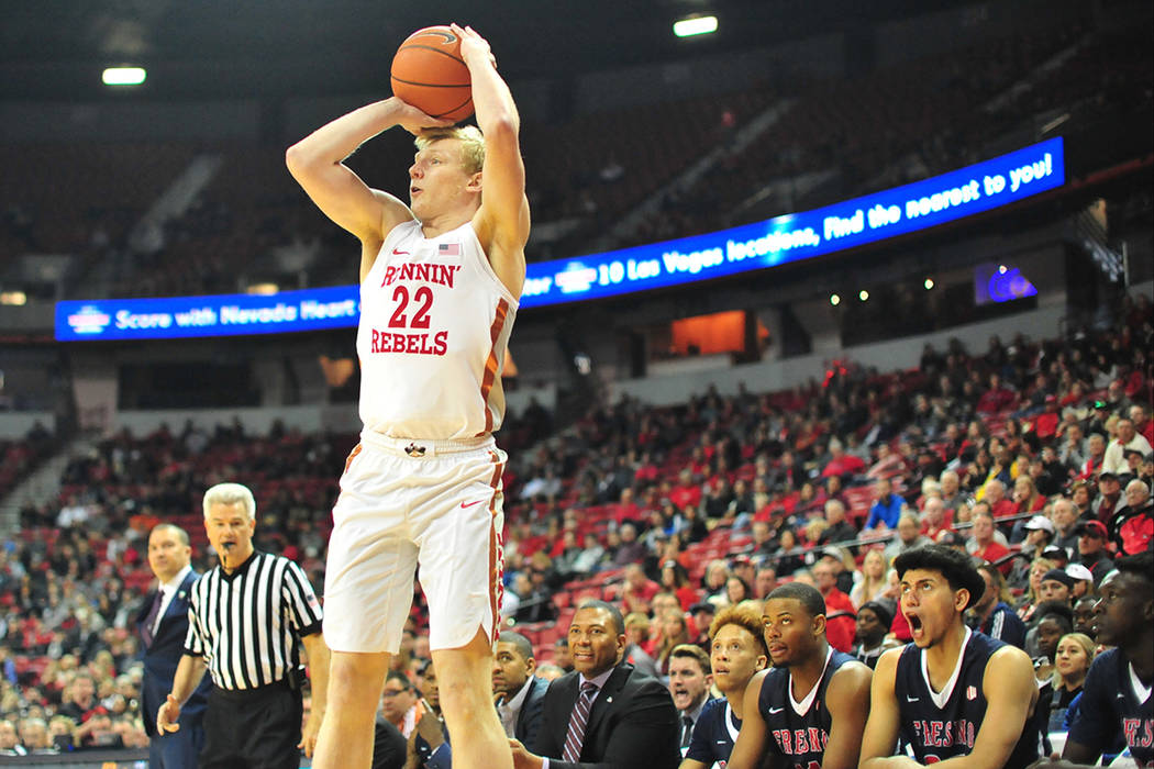 UNLV Rebels guard Trey Woodbury (22) takes a three-point shot during the first half of a game b ...