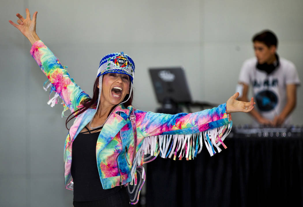 EDC traveler CarolinaWoodruff of Jacksonville, Florida, dances as DJ Play performs for visitors ...