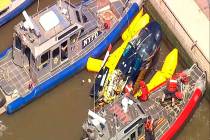 In this image made from video provided by WABC-TV, harbor units from the New York City police a ...