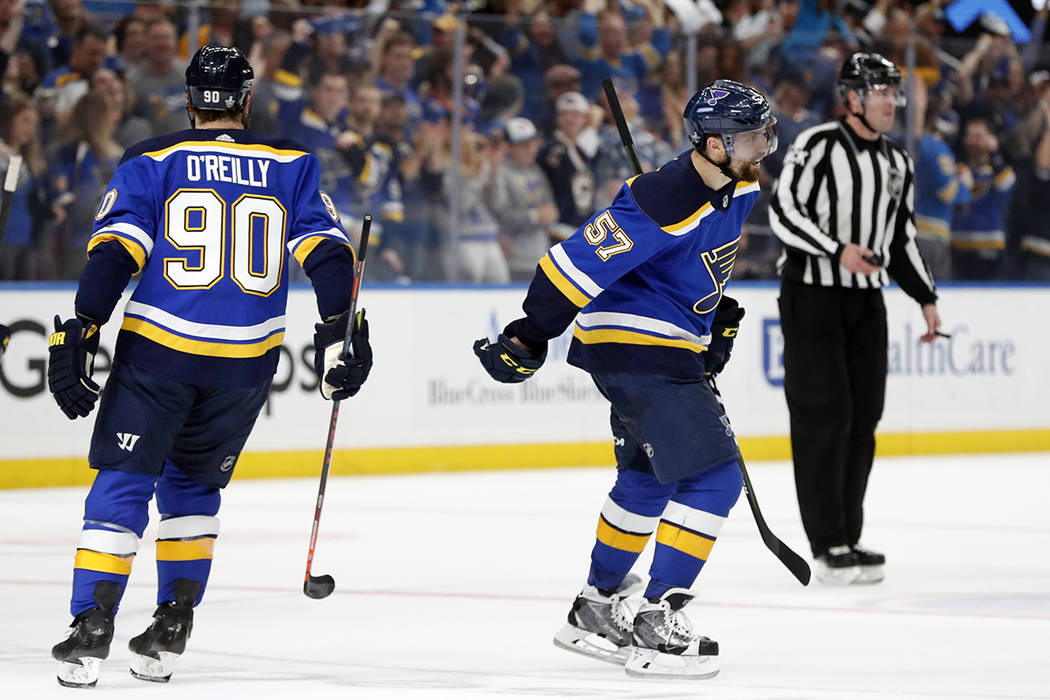 St. Louis Blues left wing David Perron (57) celebrates with Ryan O'Reilly (90) after Perron sco ...