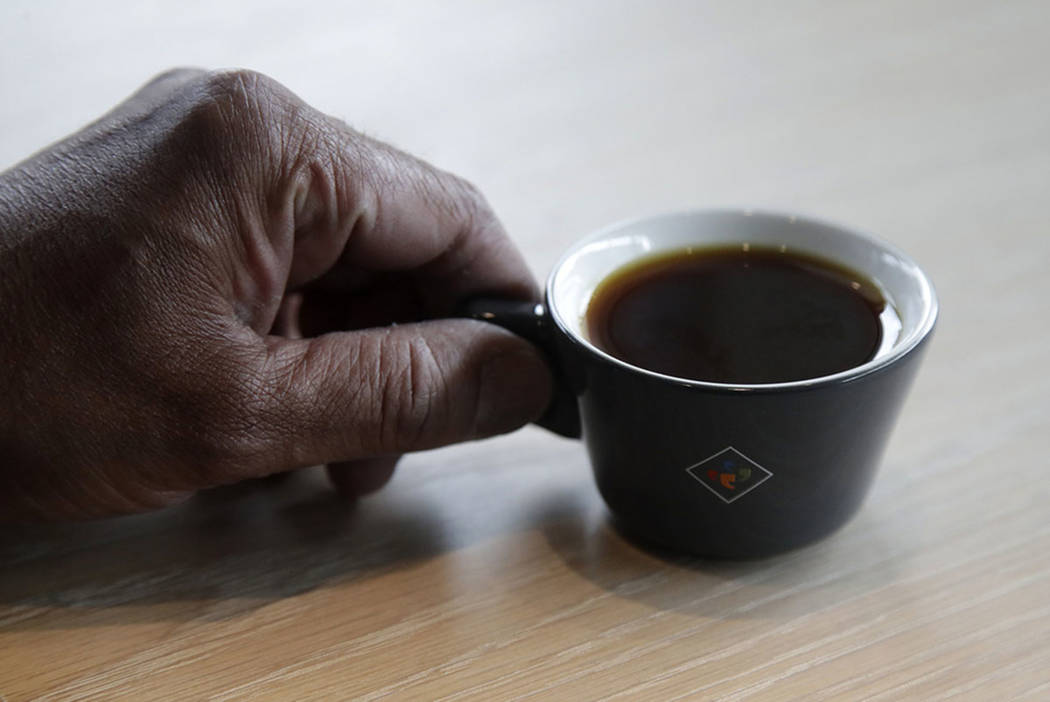 Klatch Coffee owner Bo Thiara holds a cup of Elida Natural Geisha coffee at his shop in San Fra ...