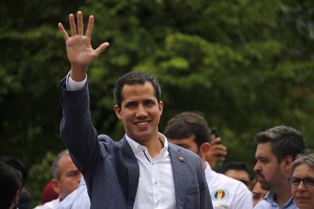 Opposition leader Juan Guaidó greets supporters at a rally in Caracas, Venezuela, Saturday ...