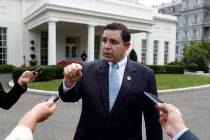 In this Sept. 13, 2017 file photo, Rep. Henry Cuellar, D-Texas, speaks with reporters outside t ...