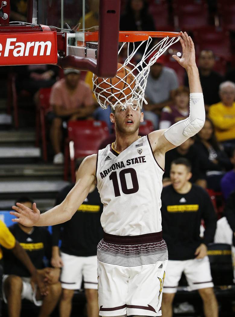 Arizona State forward Vitaliy Shibel (10) watches the ball go through the hoop during the secon ...