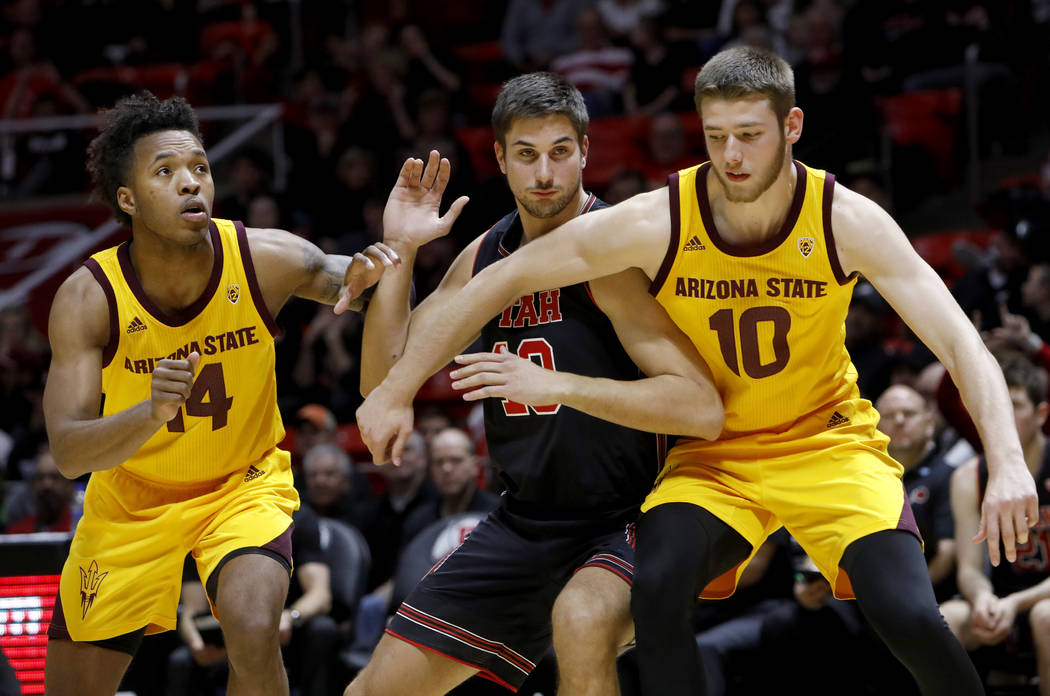 Arizona State's Kimani Lawrence (14) and Vitaliy Shibel (10) compete with Utah's Novak Topalovi ...