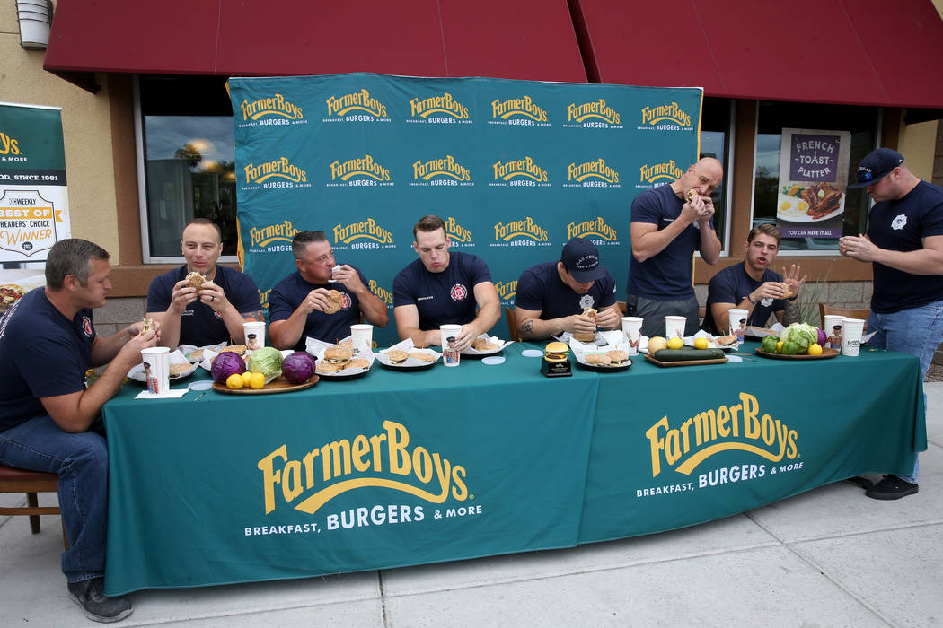 Clark County and Las Vegas firefighters in a burger eating competition at Farmer Boys at 5955 S ...