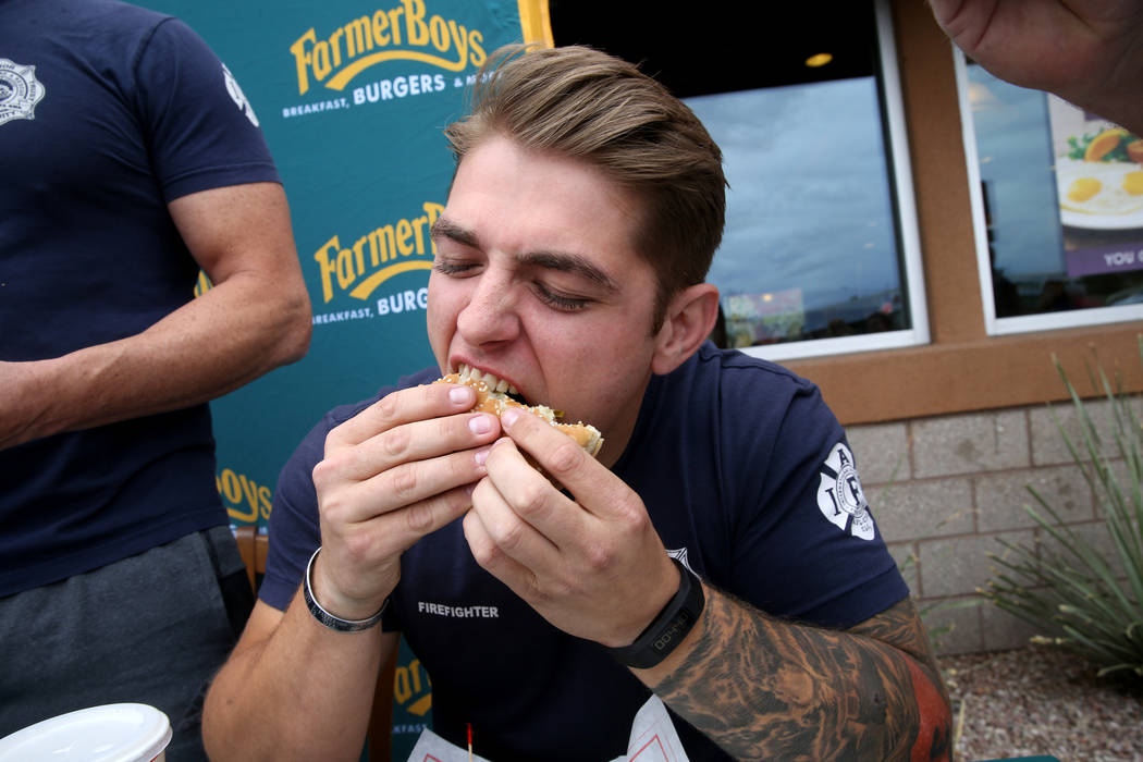 Las Vegas firefighter Kelby Lytle and his teammates compete against Clark County firefighters i ...