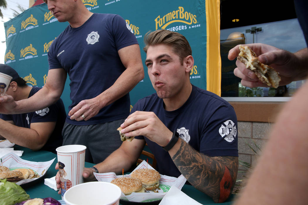 Las Vegas firefighter Kelby Lytle and his teammates compete against Clark County firefighters i ...