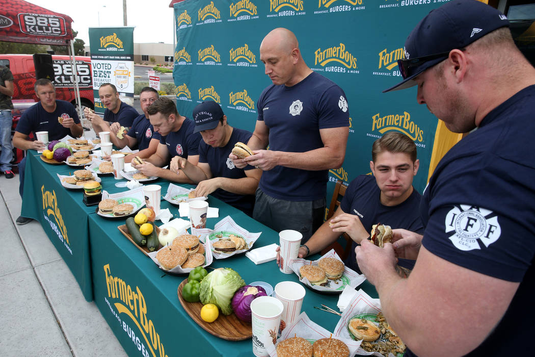 Clark County and Las Vegas firefighters in a burger eating competition at Farmer Boys at 5955 S ...