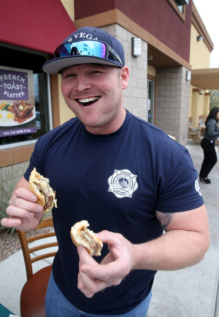 Las Vegas firefighter Zach Lamboo and his teammates compete against Clark County firefighters i ...