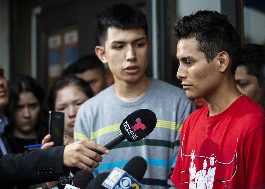 Surrounded by family members and supporters, Marlen Ochoa-Lopez's husband, Yiovanni Lopez, talk ...