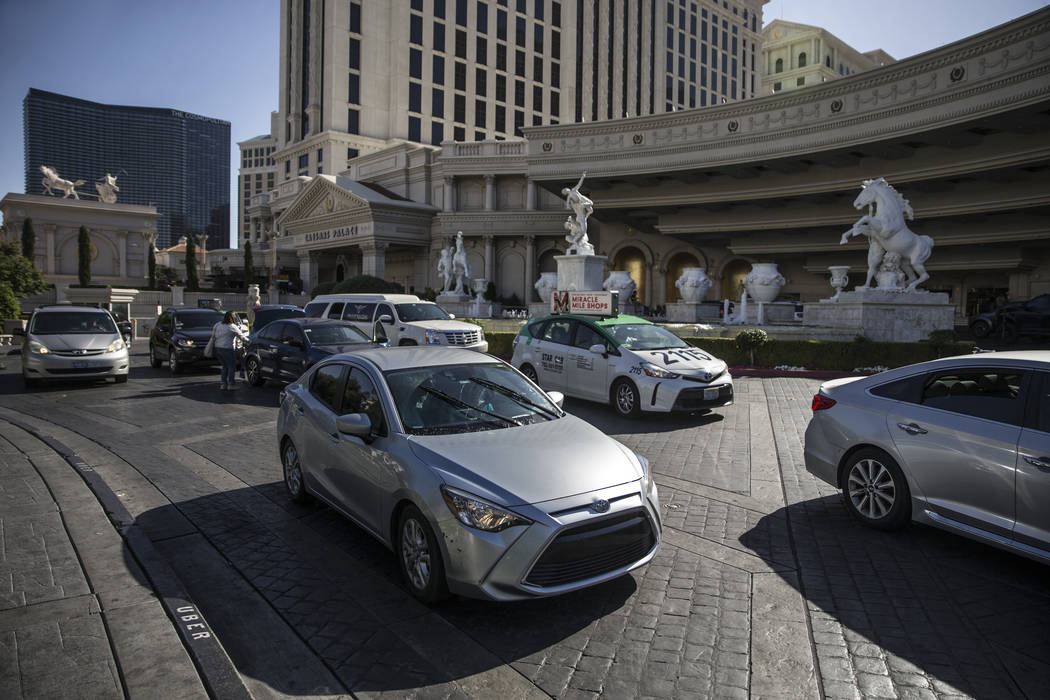 Cars exit the main entrance at Caesars Palace on Thursday, May 16, 2019, in Las Vegas. (Las Veg ...