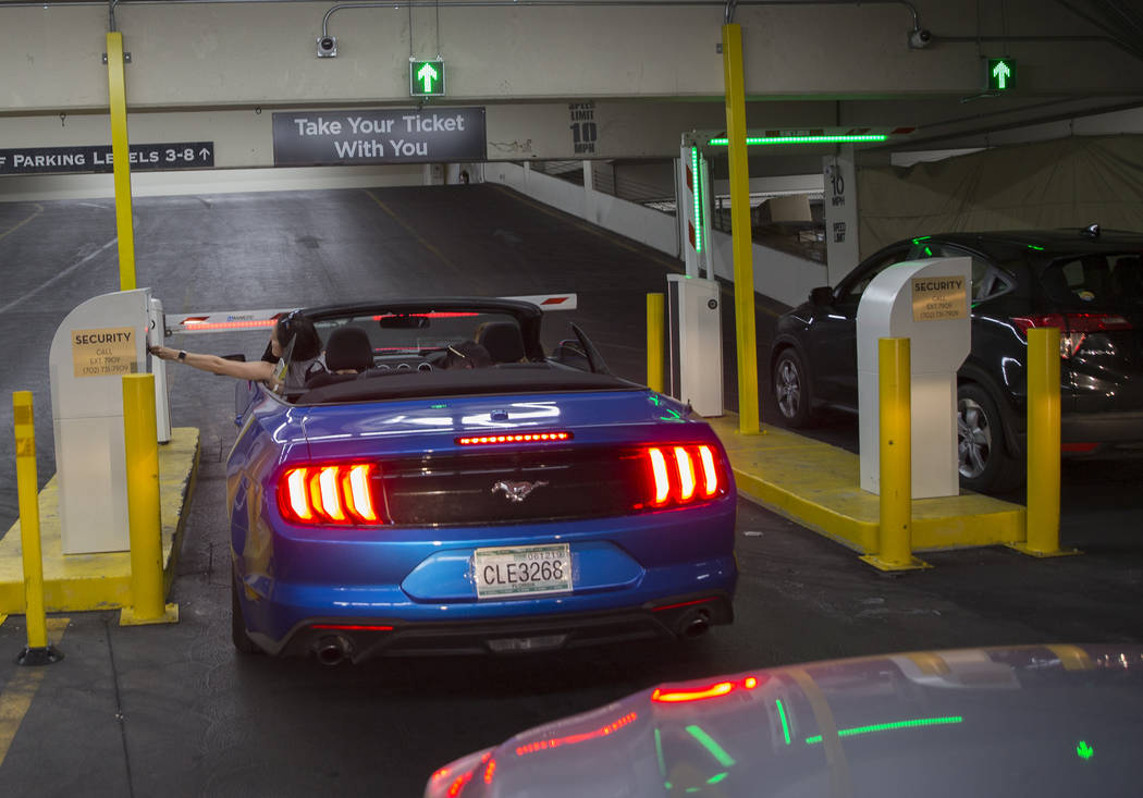 Guests pay for parking at the Caesars Palace garage on Thursday, May 16, 2019, in Las Vegas. (L ...