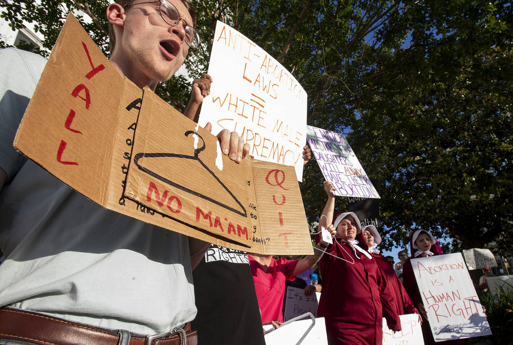 Dana Sweeney chants during a rally against a ban on nearly all abortions outside of the Alabama ...