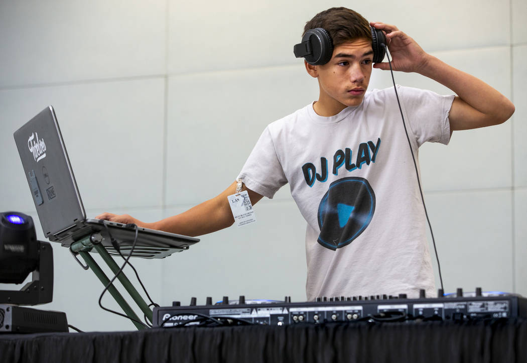 DJ Play performs for travelers including EDC visitors arriving through Terminal 3 at McCarran I ...