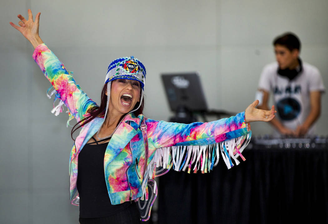 EDC traveler Carolina Woodruff of Jacksonville, Florida, dances as DJ Play performs for visitor ...