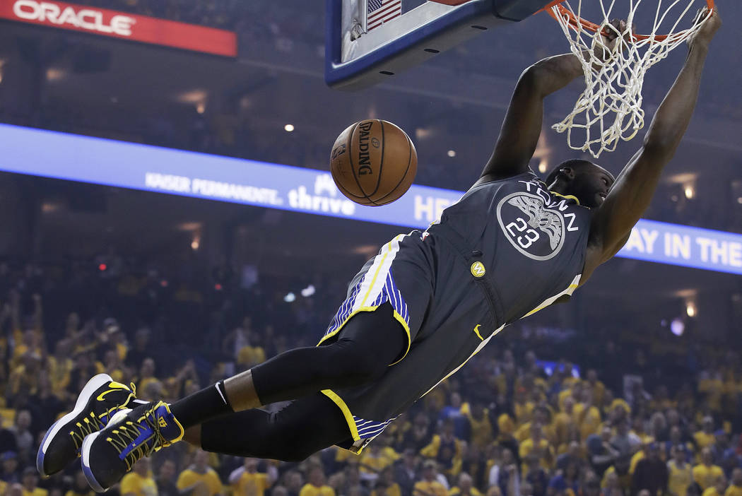 Golden State Warriors forward Draymond Green dunks against the Portland Trail Blazers during th ...