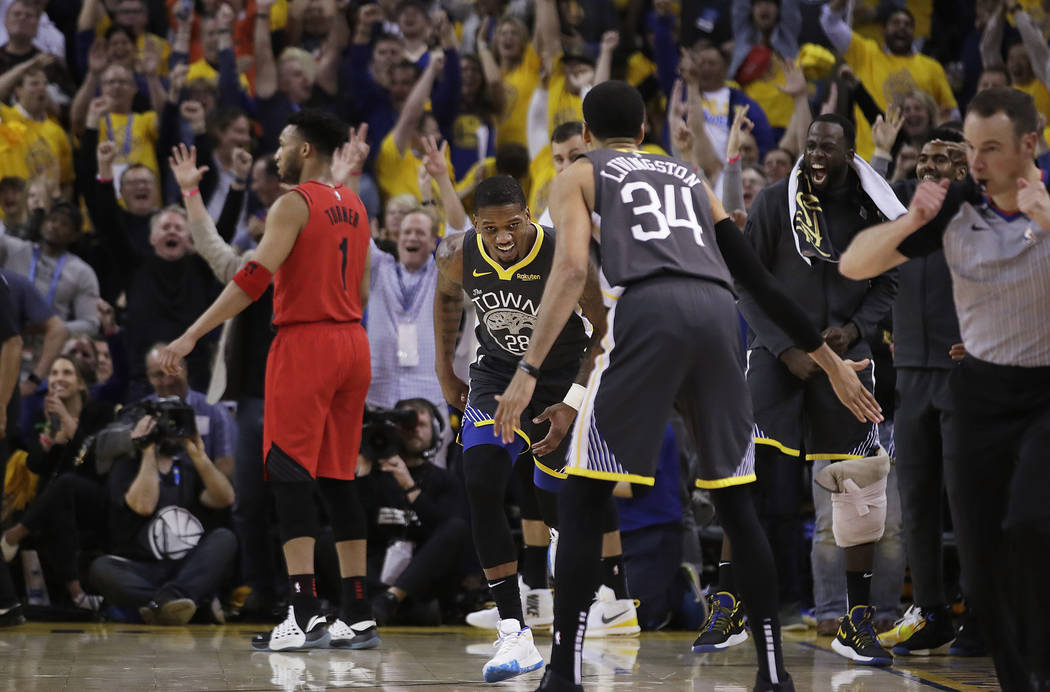 Golden State Warriors forward Alfonzo McKinnie (28) smiles after scoring against the Portland T ...