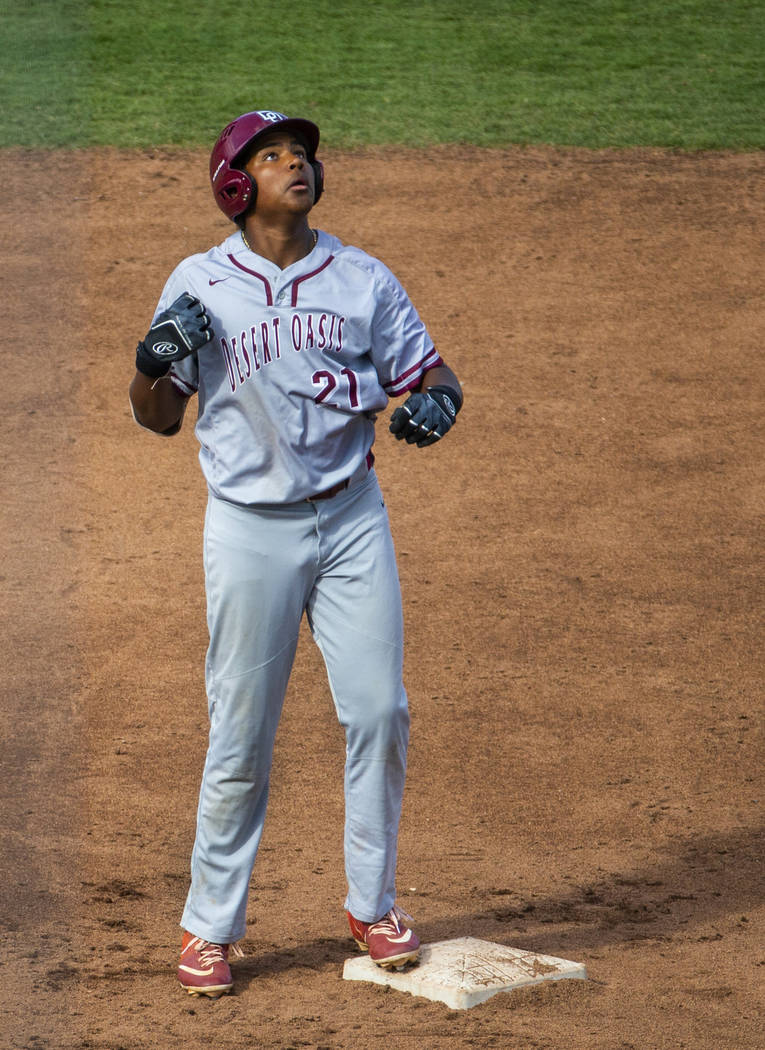 Desert Oasis runner Jacob Walsh (21) looks up at second base versus Reno in the second inning d ...