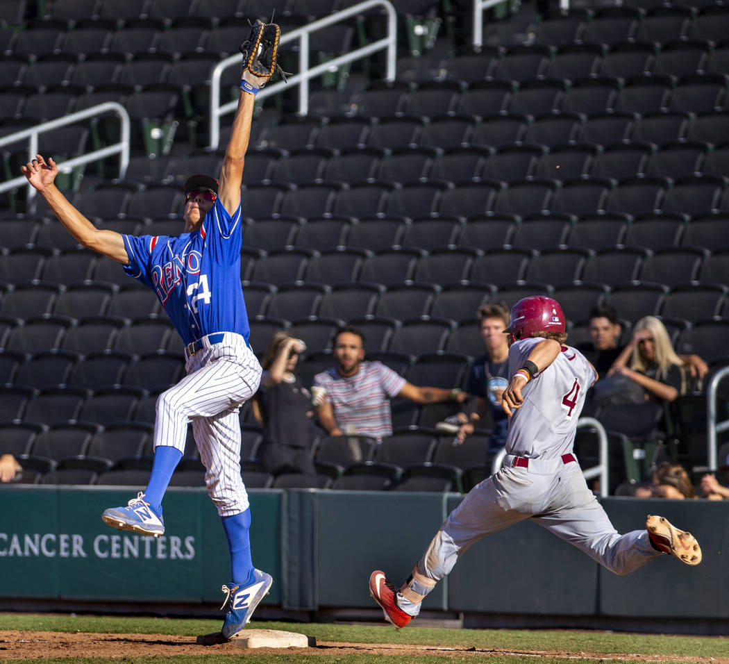 Reno's Skylar Hales (24) extends for a tough catch at first base make the out over Desert Oasis ...