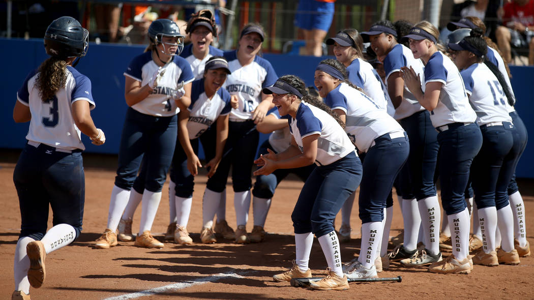 Shadow Ridge players celebrate a home run by Caitlyn Covington (3) in their Class 4A state cham ...