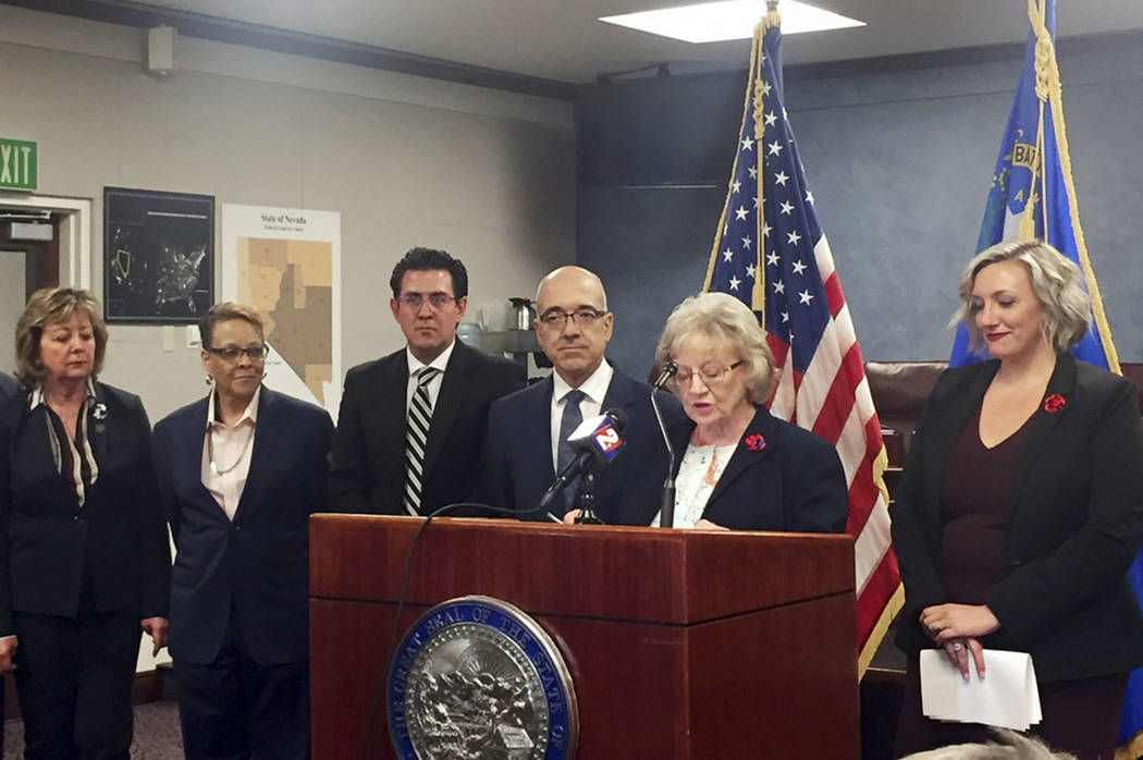Nevada state Sen. Joyce Woodhouse, D-Henderson, at podium, speaks at a news conference about a ...
