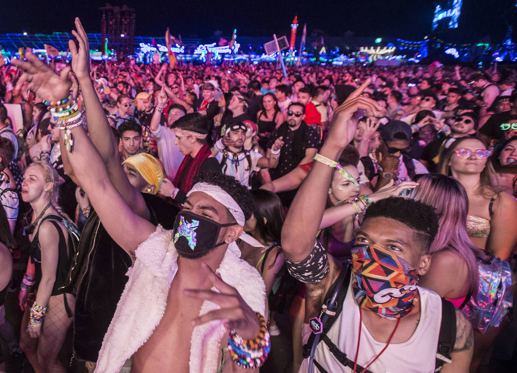 Concert goers dance at the Circuit Grounds stage during day two of Electric Daisy Carnival at L ...