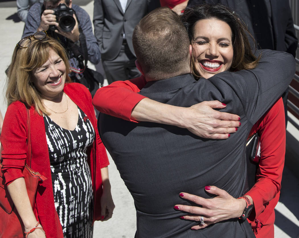 UNLV athletic director Desiree Reed-Francois, right, hugs new UNLV men's basketball coach T.J. ...