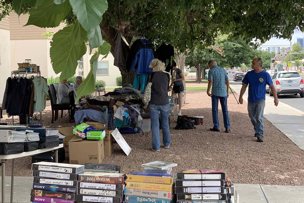 Residents of Desert Plaza Senior Apartments hold a yard sale to raise money for Serge Fournier' ...